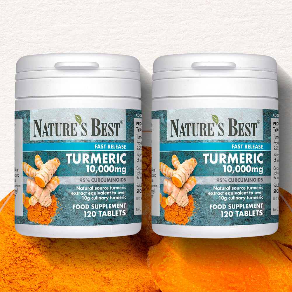 Two bottles of Nature's Best Turmeric 10,000mg supplement with turmeric powder in the background.