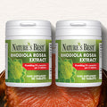 Two bottles of Nature's Best Rhodiola Rosea Extract on a wooden surface.