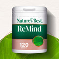Nature's Best ReMind supplement container on a green leaf background