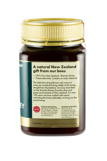 Bottle of Manuka Honey with label on a white background