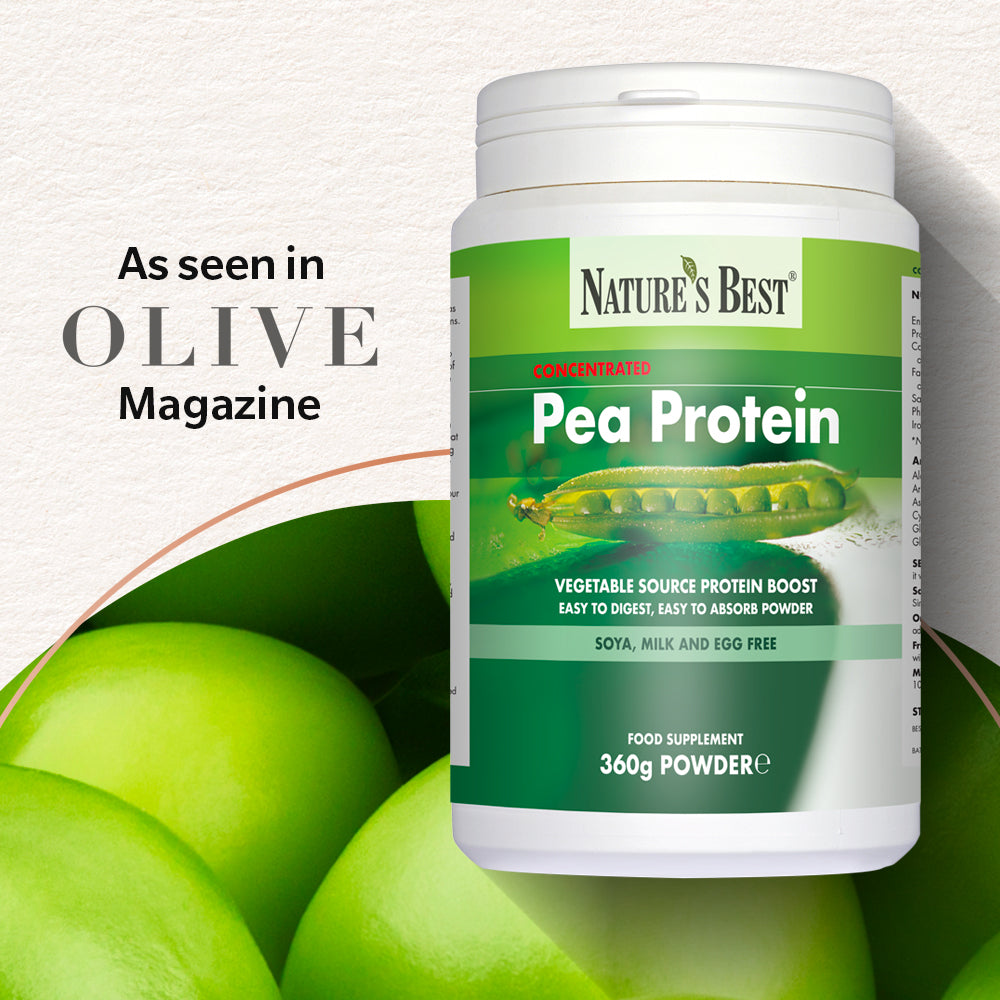 A white plastic tub of Nature's Best Pea Protein powder with a green and white label, set against a textured off-white background with green pea graphics and text reading 'As seen in Olive Magazine'.