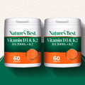 Two containers of Nature's Best Vitamin D3 & K2 on a white background