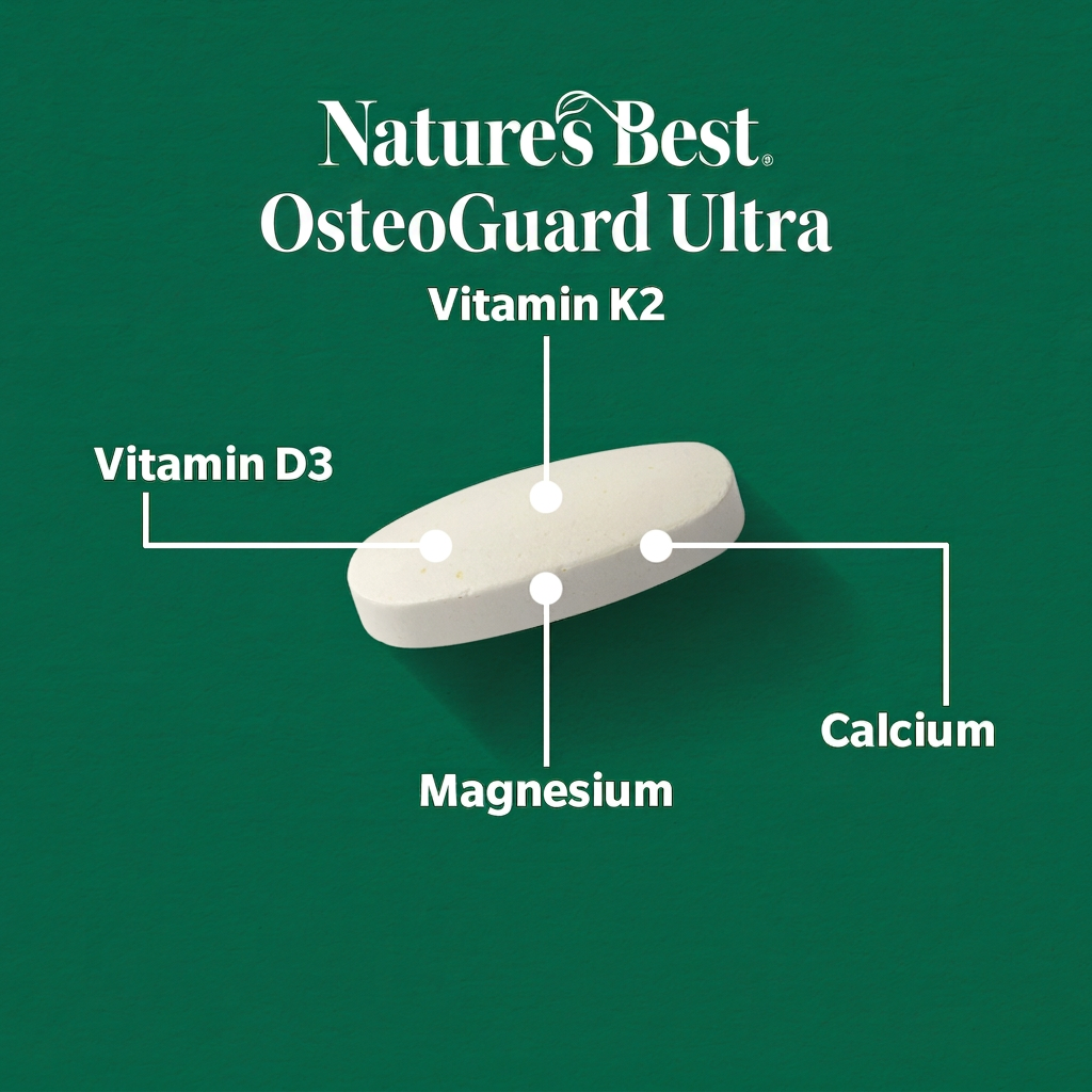 A white oval supplement tablet labeled Natures Best OsteoGuard Ultra, shown on a dark green background with callout lines pointing to Vitamin K2, Vitamin D3, Magnesium, and Calcium.
