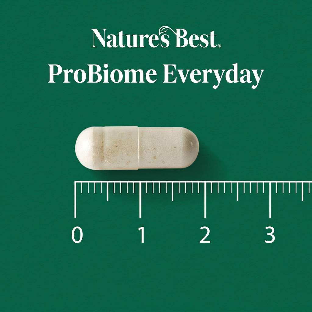 A single off-white capsule pill centered on a dark green background, with the text 'Natures Best ProBiome Everyday' above it and a ruler scale below showing millimeter measurements.