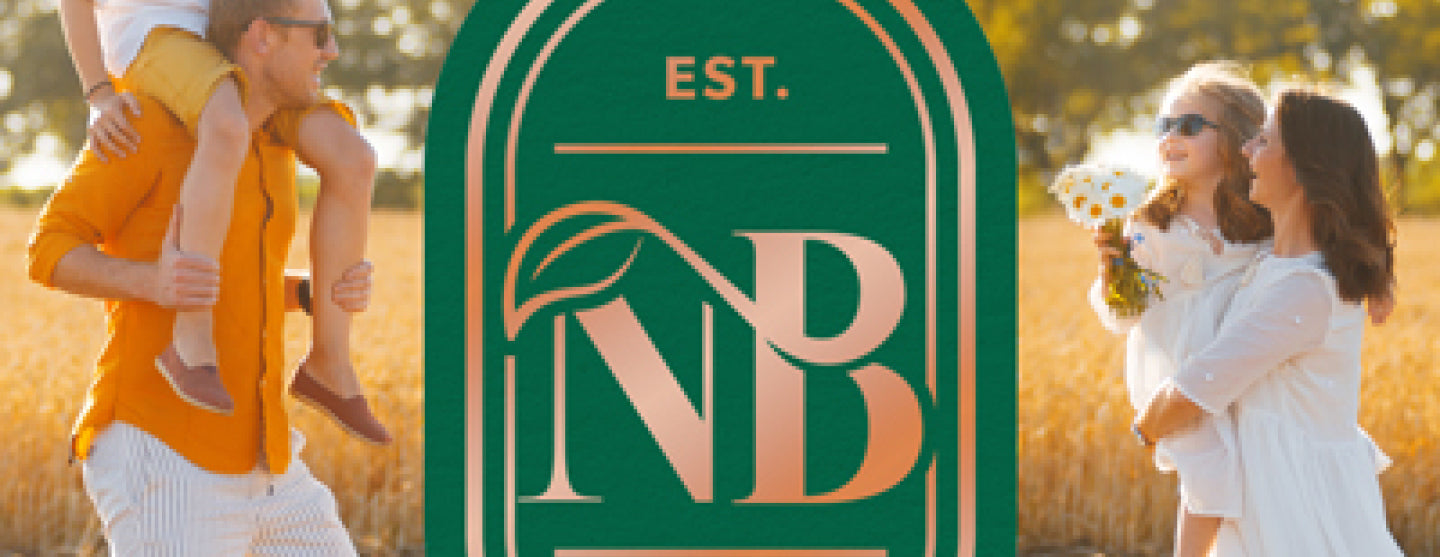 Family in a field with a logo featuring 'NB' and 'EST.'