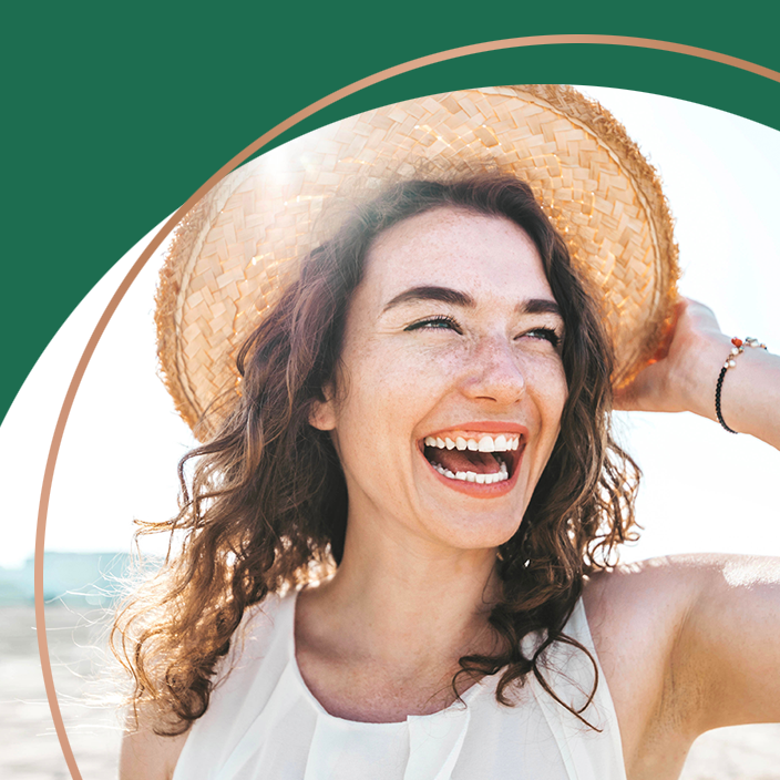 Lady wearing hat and smiling